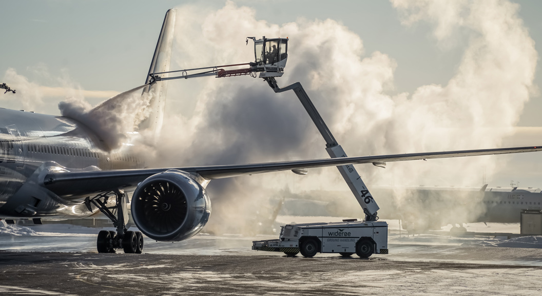 Aircraft are de-iced at the airport in winter.