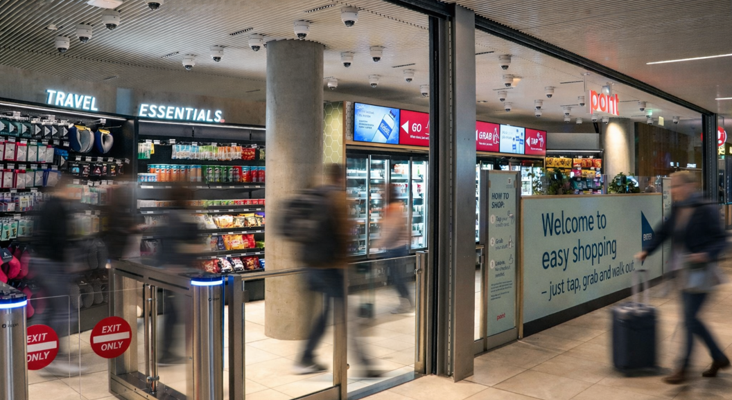Convenience store with "Point" signage offering snacks, beverages, and coffee combo deals inside an airport terminal